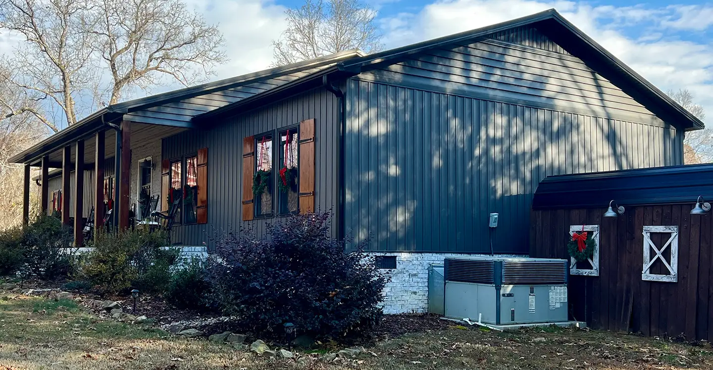 Redeem Roofing & Construction crew working on a Triad home exterior